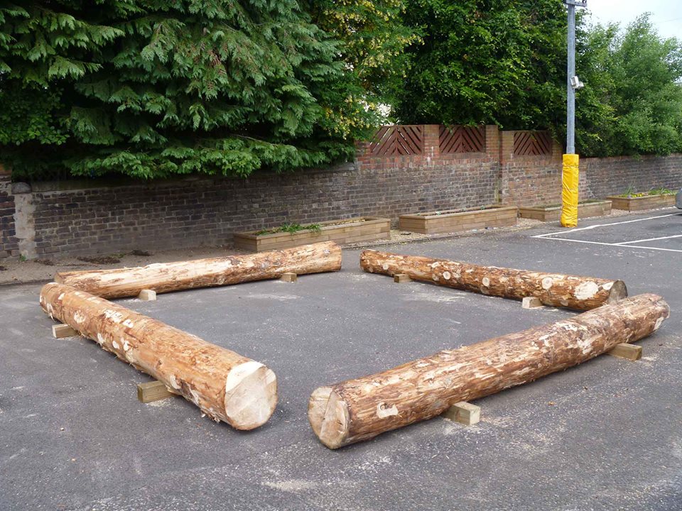 Benches, fort, log cabin, spaceship? They are in the right spot to become all of these things!